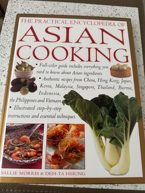 The Practical Encyclopedia of Asian Cooking coffee table book and cookbook.